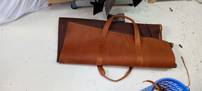 Custom-made, light brown leather duffle bag within custom made realization