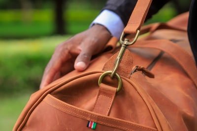 Custom-made, light brown leather duffle bag