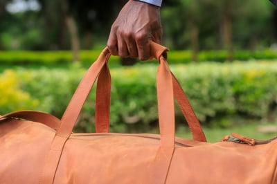 Custom-made, light brown leather duffle bag