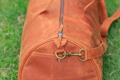 Custom-made, light brown leather duffle bag